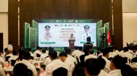Bupati Pamekasan Baddrut Tamam saat memberikan sambutan di acara launching Universal Health Coverage (UHC) di Hotel Azana, Jalan Jokotole, Pamekasan.