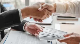 Corruption and Bribery ,Businessman shaking hands giving dollar bills corruption bribery to business manager to deal contract